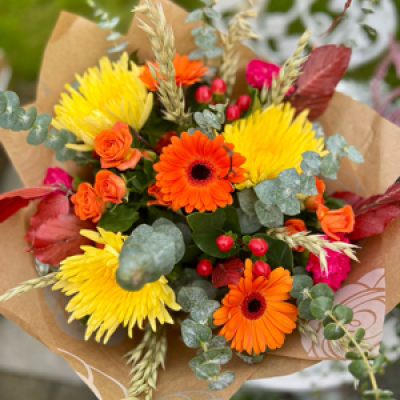Seasonal Handtied - Bright seasonal flowers, including autumn blooms, berries and dried wheat stems.