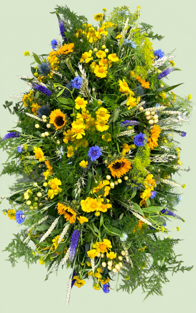 Meadow - Natural Meadow Casket Spray

A beautiful, abundant casket spray inspired by a wild summer meadow. Filled with golden sunflowers and cheerful yellow blooms, complemented by soft blue and purple flowers, delicate grasses, seed heads and fresh seasonal foliage. A natural, uplifting tribute celebrating a life with warmth, colour and the beauty of nature.